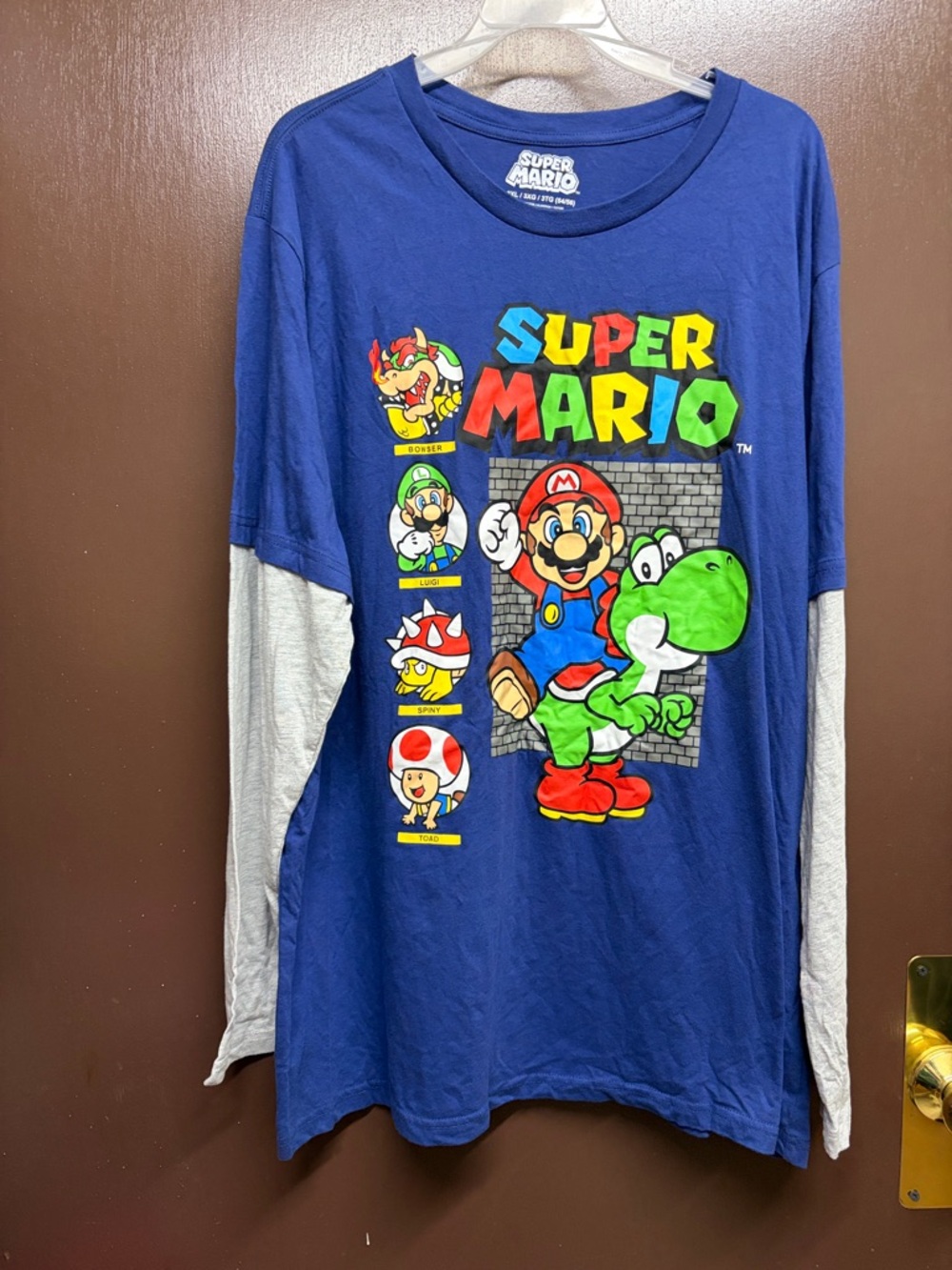 Nintendo Super Mario Logo on Blue Shirt